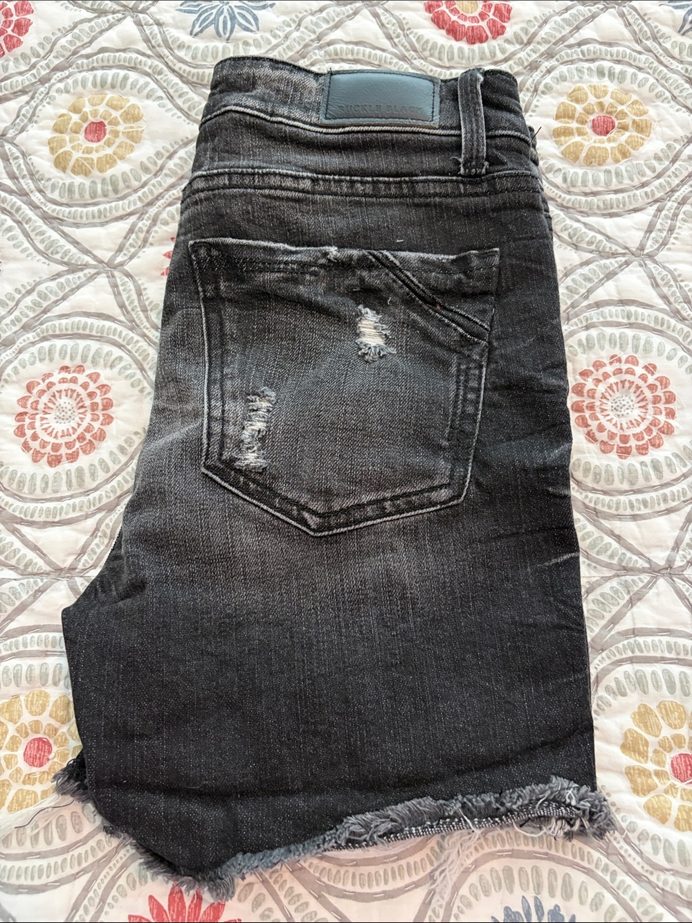 Buckle Black Fit No. 53 black wash distressed jean shorts, size 27.